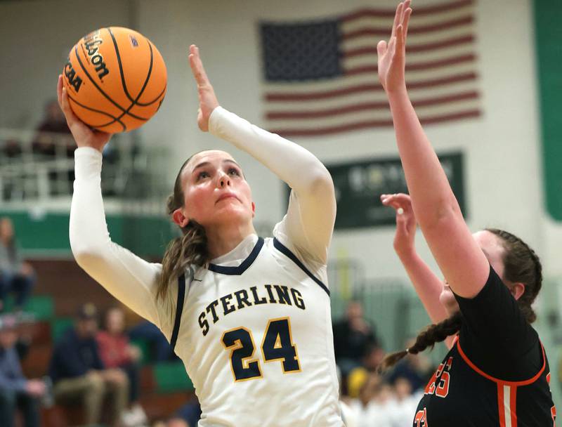 Sterling's Madison Austin shoots over Crystal Lake Central's Leah Spychala during their Class 3A sectional semifinal game Tuesday, Feb. 25, 2025, at Boylan Catholic High School in Rockford.