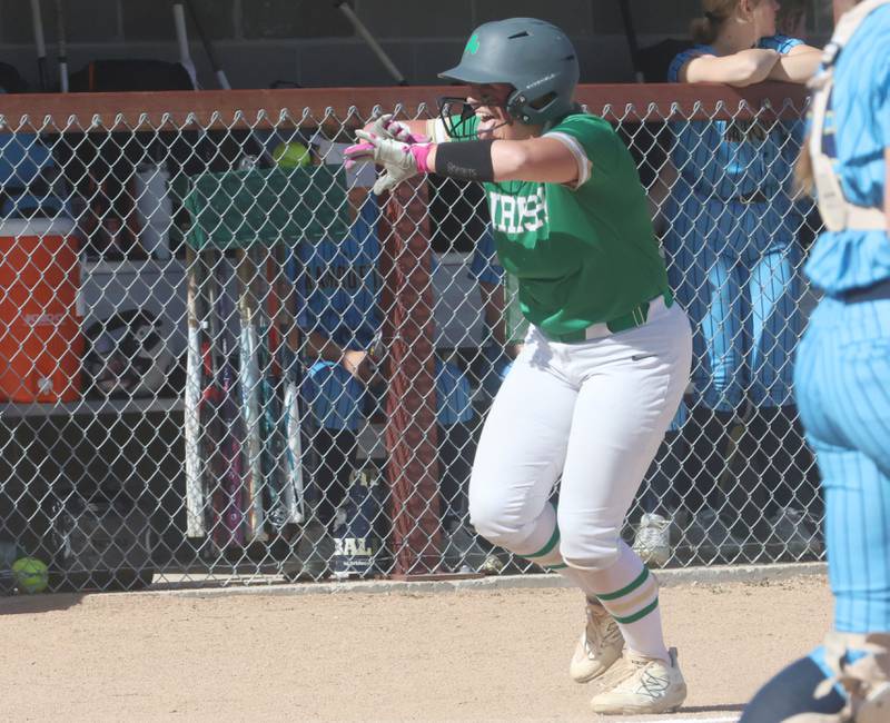 Seneca's Emma Mino reacts after hitting a home run on Monday, May 11, 2026 at June Gross Field in Ottawa.