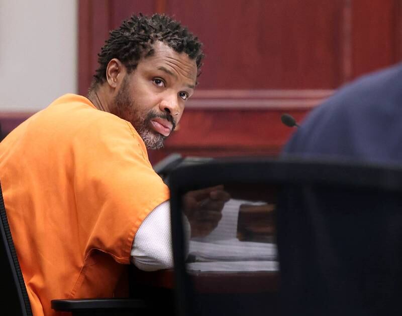 Matthew L. Martin listens to lead prosecutor Daniel Regna during a pretrial hearing Thursday, April 3, 2025, at the DeKalb County Courthouse in Sycamore. Martin is charged with robbing a DeKalb bank in July 2024.