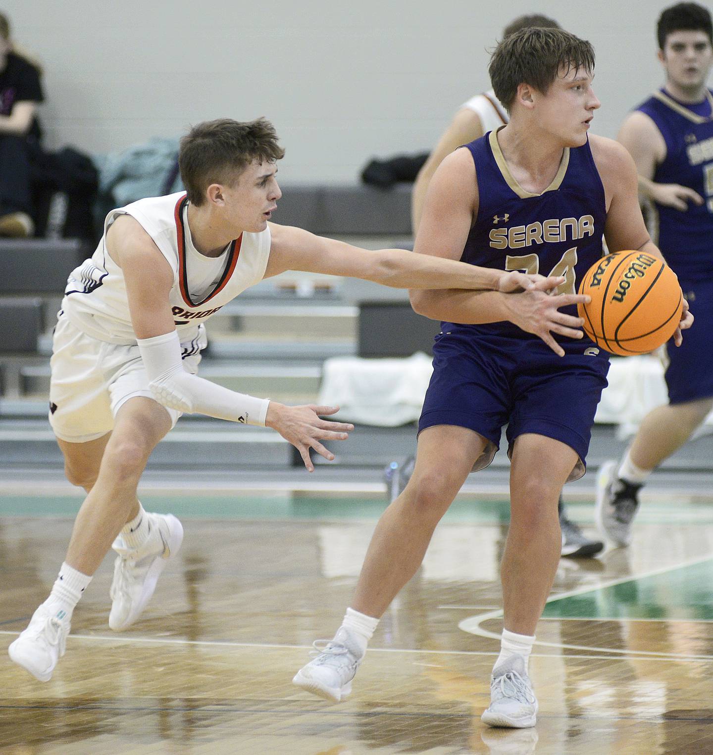 Woodland’s Noah Decker attempts to steal the ball from Serena’s Matt Farrell in the second period Thursday during the Shipyard Showdown Tournament at Seneca.