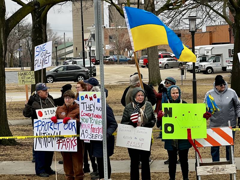 A crowd gathers to protest President Donald Trump and his administration in Sterling, Illinois, on Friday, March 7, 2025.