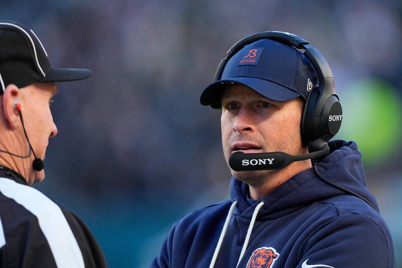 Chicago Bears head coach Ben Johnson talks to an official during the first half of an NFL football game against the Philadelphia Eagles, Friday, Nov. 28, 2025, in Philadelphia. (AP Photo/Chris Szagola)