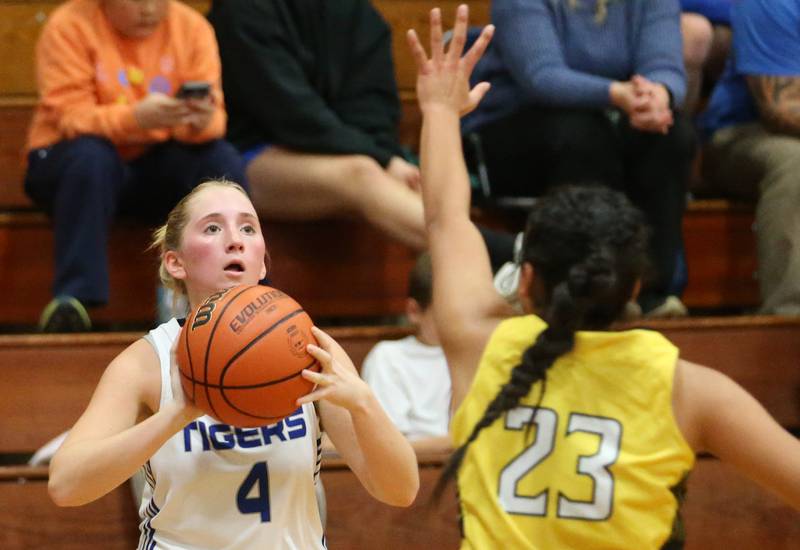 Princeton's Paige Jesse looks to shoot a shot over Putnam County's Valeria Villagomez during the Princeton Holiday Girls Basketball Tournament on Tuesday, Nov. 19, 2024 at Princeton High School.