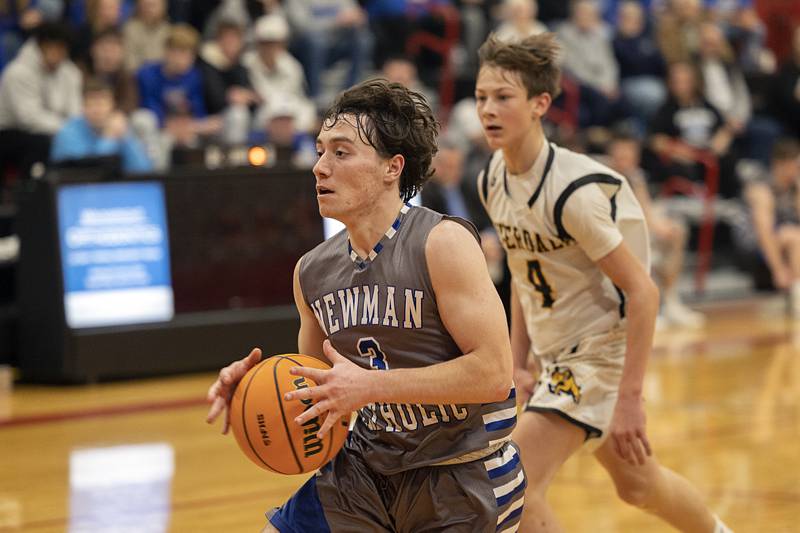 Newman’s Garret Matznick drives to the hoop against Riverdale Tuesday, Dec. 30, 2025, in the final of the boys Cliff Warkins Basketball Tournament at Erie High School.