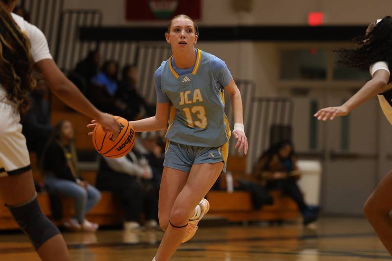 Joliet Catholic’s Abigail Dulinsky looks for a play against Marian Catholic on Wednesday, Jan. 14, 2026 in Chicago Heights.