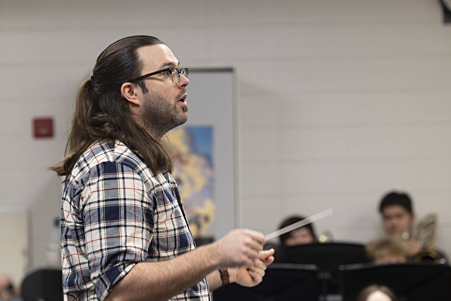 Sterling High School band director Brendon O’Donnell directs his group Thursday, April 13, 2023.