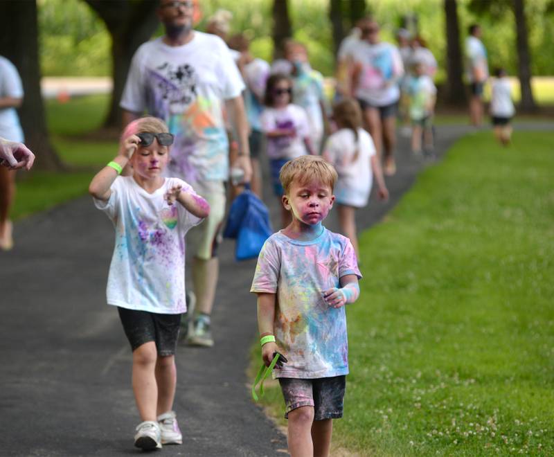 Kids walk to the finish line of the Oregon Park District's Color Run on Tuesday, July 22, 2025 at Oregon Park West.