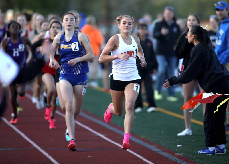 St. Charles East’s Marley Andelman leads the 800-meter run during the 2024 Kane County Girls Track and Field meet at St. Charles East on Thursday, April 25, 2024.