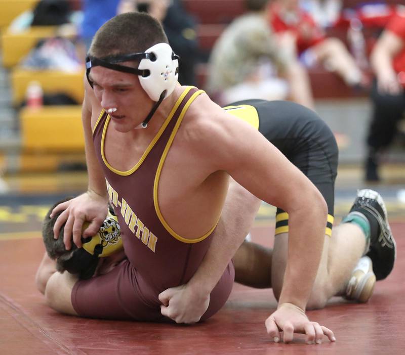 Richmond-Burton’s Dylan Falasca tries to get away from the grasp of Joliet West’s Tristan Radeke during a175-pound match in the Tom DuBois Invite wrestling meet on Saturday, Dec. 13, 2025, at Richmond-Burton High School in Richmond.