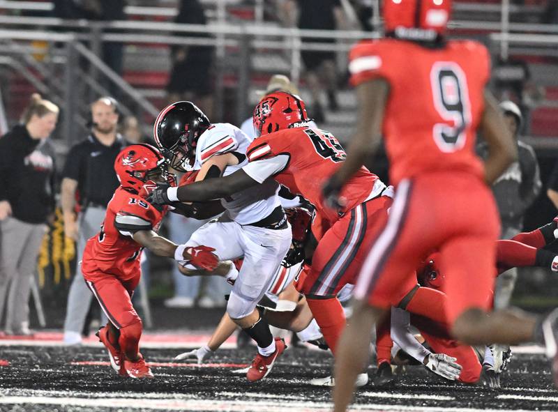 Lincoln-Way Central's Braden Meyer tries to pickup a first down during a non-conference game against Bolingbrook on Friday, Sep. 29, 2023, at Bolingbrook. (Dean Reid for Shaw Local News Network)