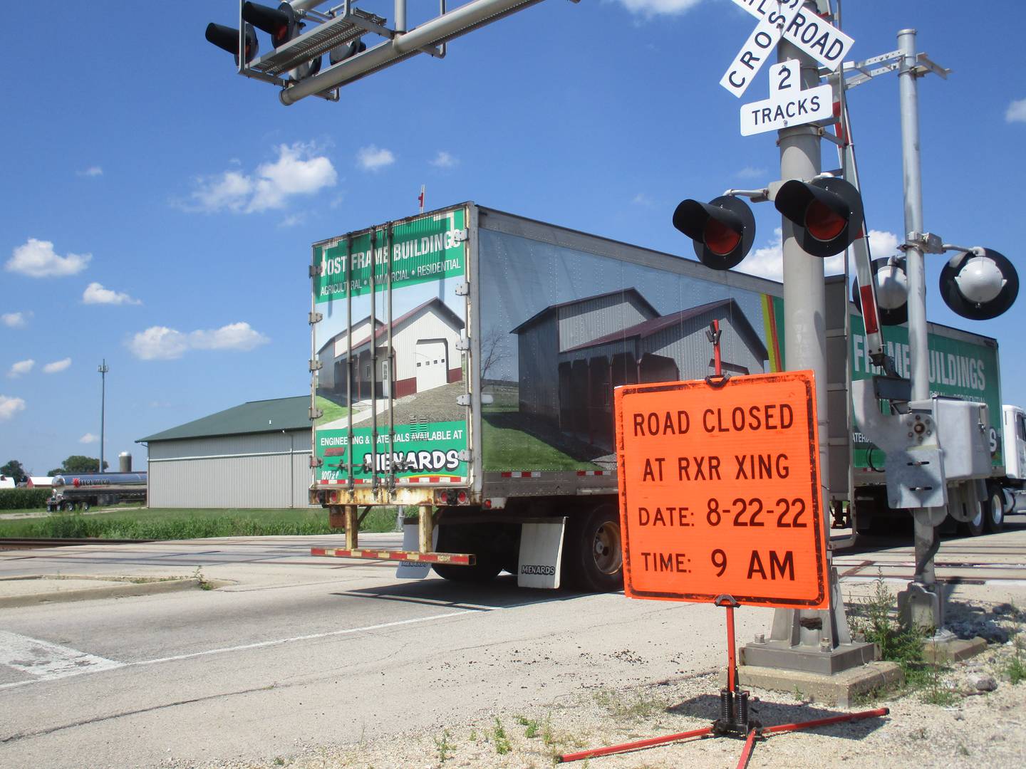 A Menards semi tractor trailer drives over the BNSF Railway crossing on its way to the home improvement giant's distribution center farther north. This vehicle slowed considerably to negotiate the crossing on Aug. 16, 2022.