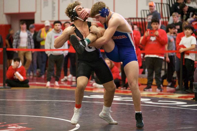 Dundee Crown's Porter Leith competes against Grant's Cameron Lattimore in the 195 lb 3rd place match at the Class 3A Sectional at Barrington High School on Saturday, Feb. 11, 2023.