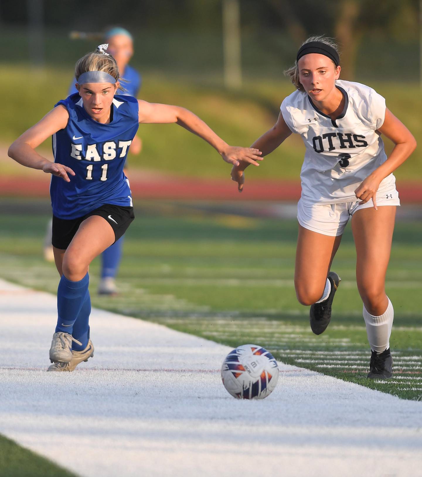Lincoln-Way East’s Cami Butler and O’Fallon’s Regan Schreckenberg chase the ball in the IHSA girls Class 3A state soccer semifinal game at North Central College in Naperville on Friday, June 2, 2023.