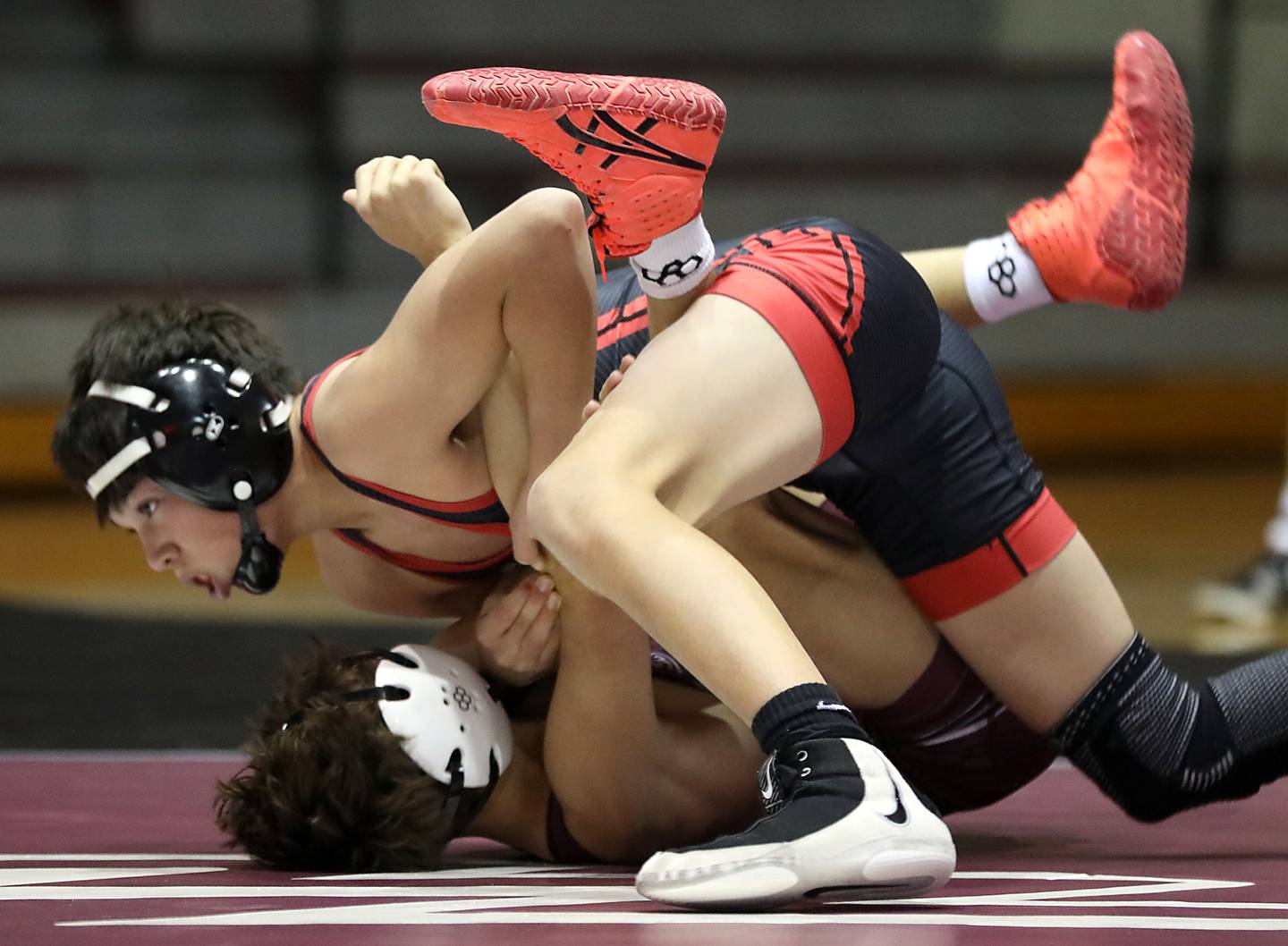 Huntley’s Noah Gutierrez pins Prairie Ridge’s Tymen Robinson during the 106-pound match of a Fox Valley Conference boys wrestling meet on Thursday, Jan. 22, 2026, at Prairie Ridge High School Crystal Lake.