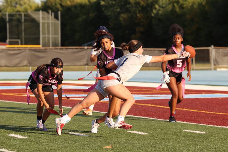 Plainfield South's Carly McDonald is stopped short of the end zone by Kankakee's Mikaylah Santoyo, left, during the Kays' 40-26 victory over Plainfield South on Monday, Oct. 6, 2025.