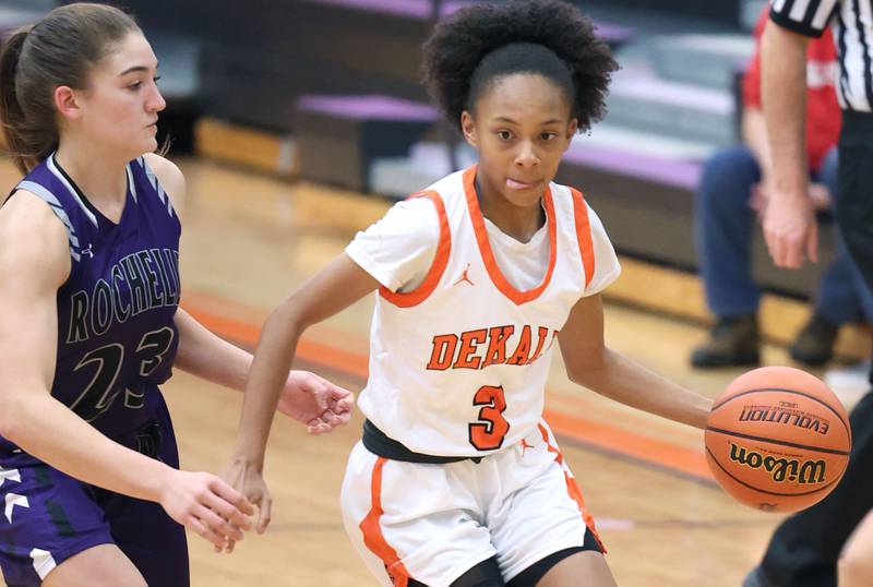 DeKalb's Madison McNeil dribbles past Rochelle's Alivia Henkel during their game Monday, Nov. 28, 2022, at DeKalb High School.