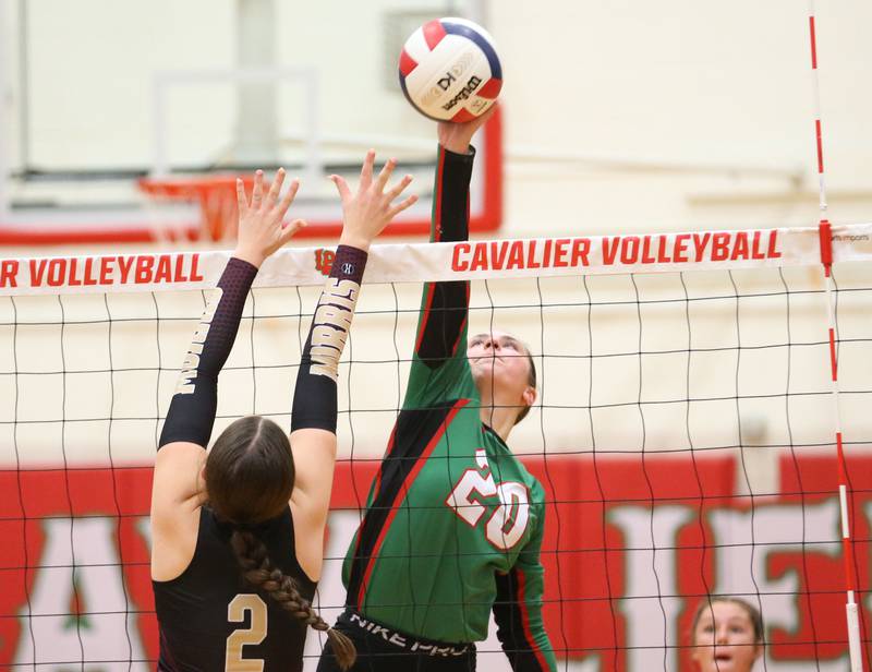 L-P's Anna Riva spikes the ball past Morris's Alexis Wiliams on Thursday, Oct. 10, 2024 in A.J. Sellett Gymnasium at L-P High School.