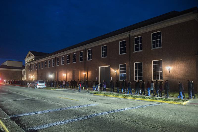 Mourners looking to pay respects to the family, line up outside of Sterling High School for the visitation of Capt. Garrett Ramos. Ramos was posthumously raised in rank to captain