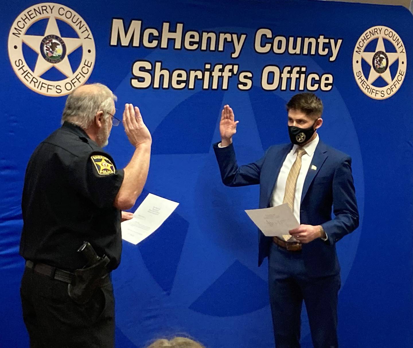 McHenry County Sheriff Bill Prim swears in Deputy Nicholas Arnold. The hiring was announced by the sheriff's office in a January 12, 2021, post on Facebook.