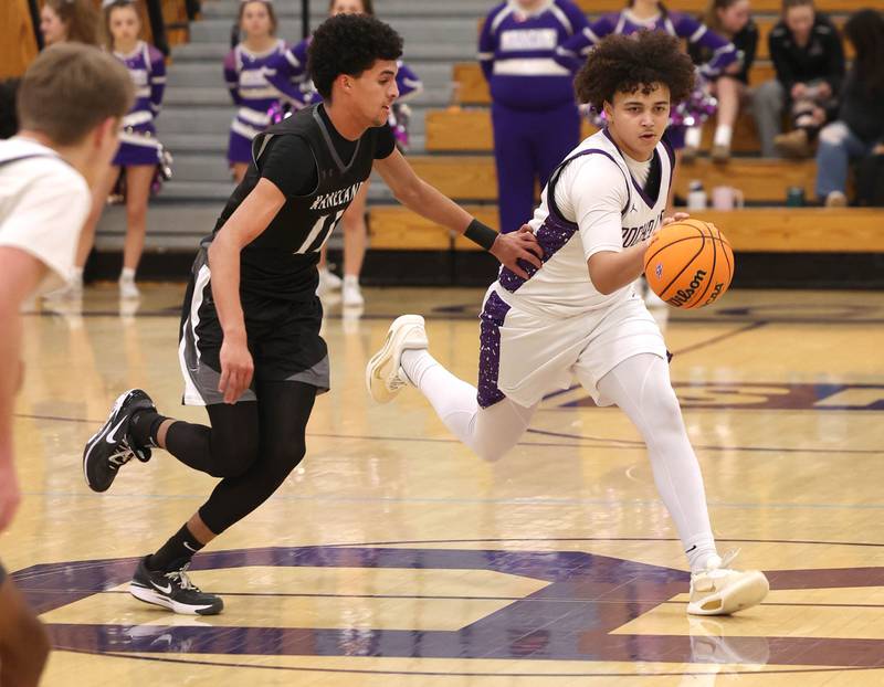 Rochelle's Martiese Pogue pushes the ball upcourt against Kaneland's Evan Frieders Tuesday, Feb. 3, 2026, during their game at Rochelle High School.