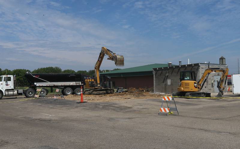 An excavator demolishes the Wash Me car wash on Wednesday, June 7, 2023 in Princeton.