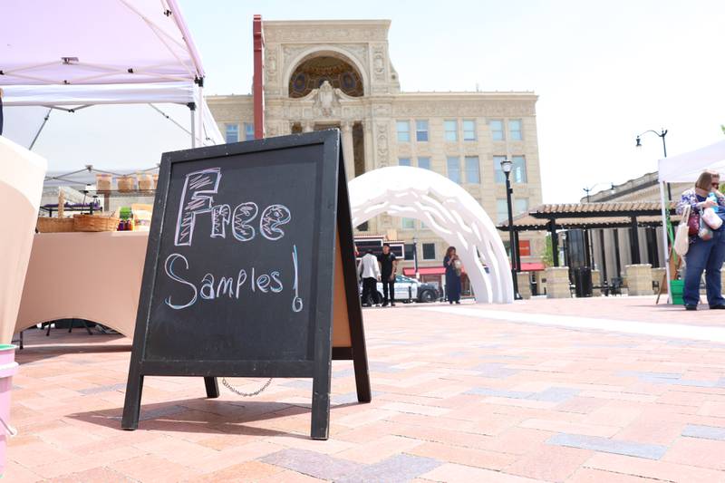 Loaves and Love tent offers free samples at the new city square for the farmers market on Friday, May 22, 2026 in Joliet.