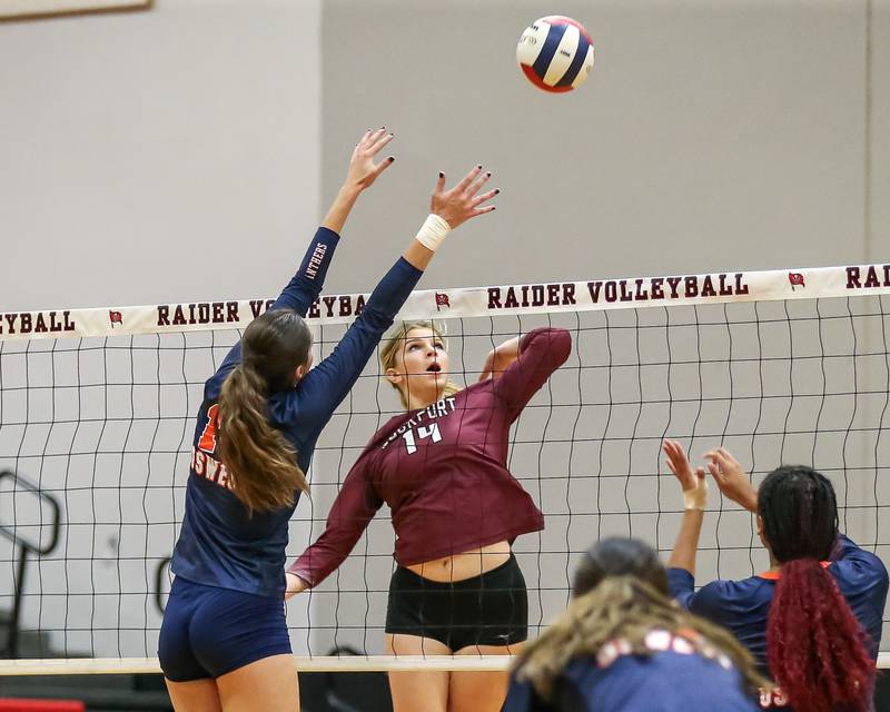 Lockport's Hutsyn Timosciek (14) spikes the ball during Class 4A Bolingbrook Sectional final match between Lockport at Oswego.  Nov 7, 2024  in Bolingbrook.