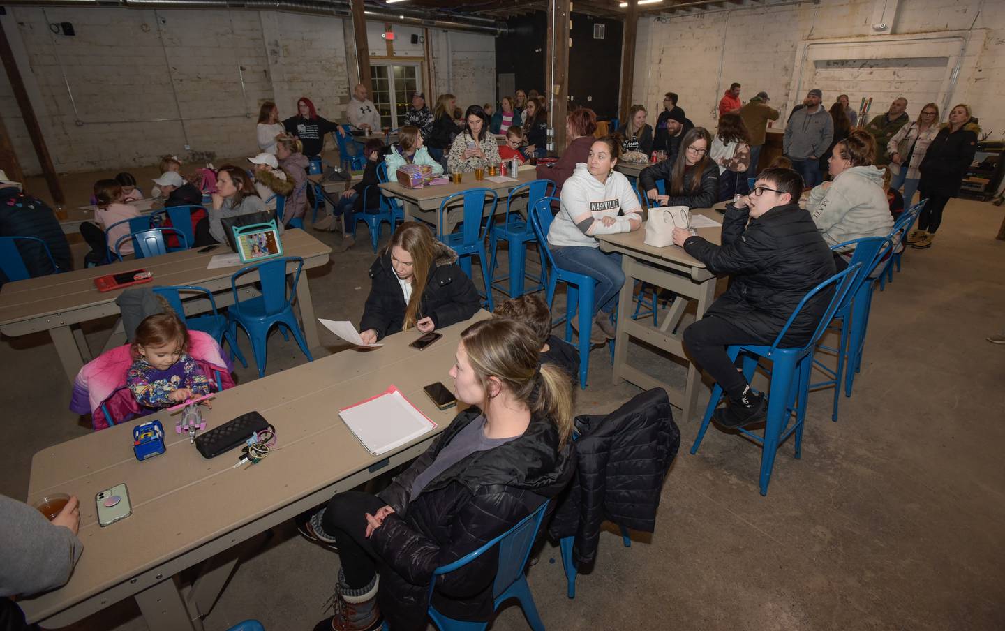 Over 50 parents and around 25 children attended the Kaneland School Board meeting watch party in a private room at Obscurity Brewery in Elburn on Monday, February 14, 2022.