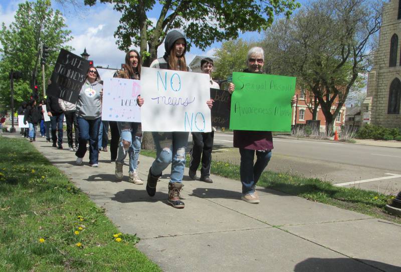 Dozens march Saturday, April 29, 2023, in the March to Believe organized by Safe Journeys at Washington Square in Ottawa.