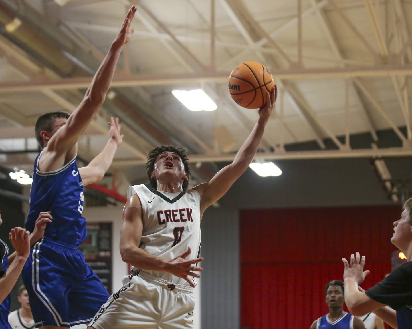 Indian Creek's Cooper Rissman (0) puts in a reverse layup during their basketball game between Newark at Indian Creek Tuesday, Jan 13, 2026 in Shabbona.