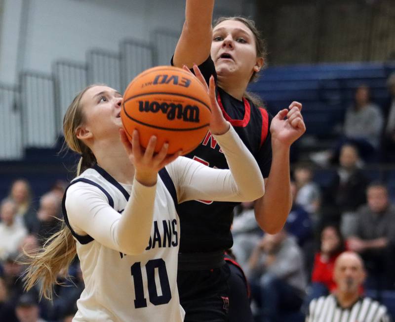 Huntley’s Paula Strzelecki, back, guards Cary-Grove’s Alivia Nielsen in varsity girls basketball on Friday, Jan. 24, 2025, at Cary-Grove High School in Cary.