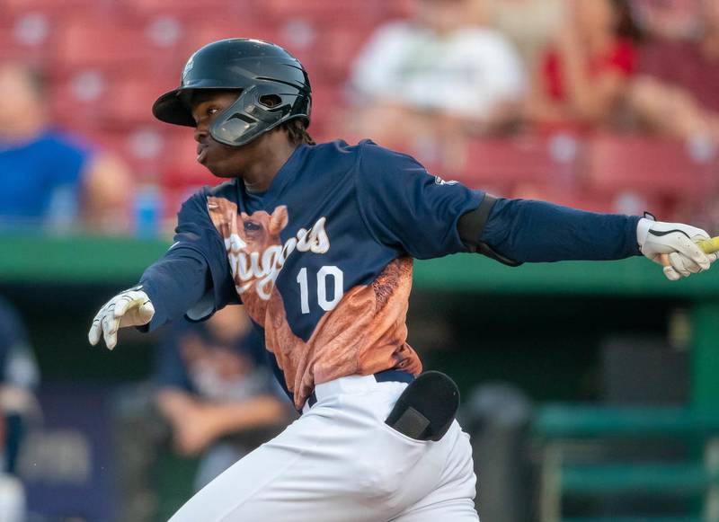 Kane County Cougars center fielder Kristian Robinson (10) hits a line drive during a game against the Cedar Rapids Kernels in Geneva Aug. 7.