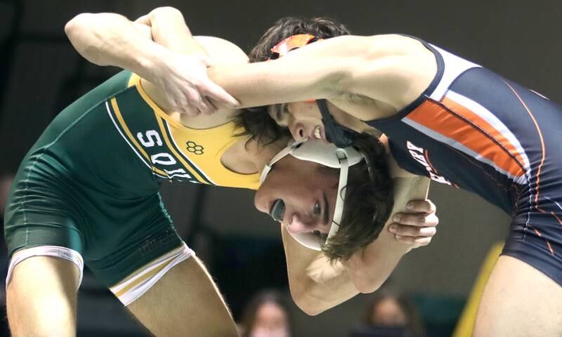Crystal Lake South’s Austin Laurie, left,  battles McHenry’s Ryan Nagel  in a 132-pound match during varsity wrestling at Crystal Lake Thursday night.