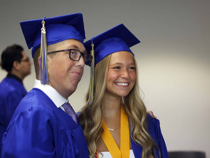 Wheaton North High School graduates Jenna Cammack and Nick Anthony pose for a photo before their graduation ceremony Saturday, May 25, 2024 in the Physical Education Center of College of DuPage in Glen Ellyn.