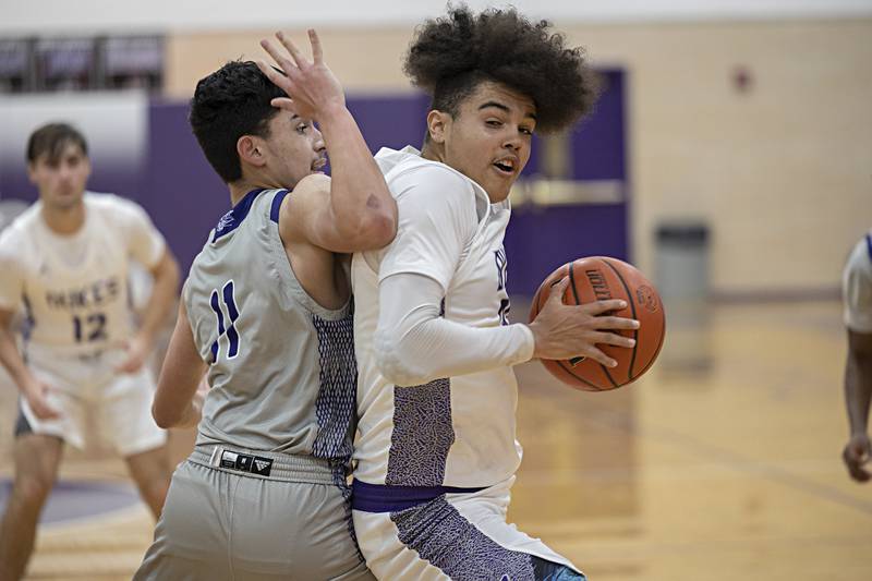Dixon’s Darius Harrington works against Plano’s Eric Cano Wednesday, Dec. 6, 2023 at Dixon High School.