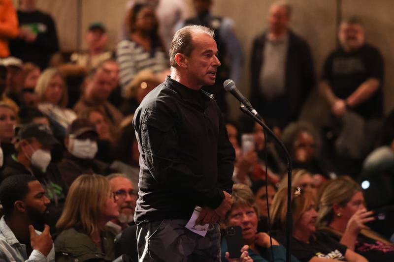 Steven Dedin has stern word for the Joliet Township member of the handling of the township asylum grant money at the meeting at Billie Limacher Bicentennial Park theater on Tuesday, Oct. 10, 2023 in Joliet.