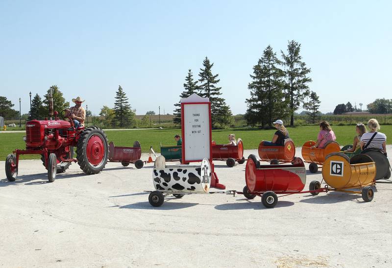 Jerritt McMillon, of Trevor, Wis., drives a Farmall Cub tractor as he gives visitors a ride in a barrel train during the Lake County Farm Heritage & Harvest Festival at the Lake County Fairgrounds on September 23rd in Grayslake. The festival was sponsored by the Lake County Farm Heritage Association.
Photo by Candace H. Johnson for Shaw Local News Network