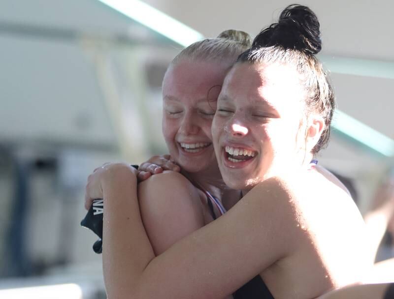 Bella Fontana of Crystal Lake South co-op, right, embraces Carly Pierzchalski of Dundee-Crown co-op after the 200-yard freestyle during the Fox Valley Conference Championship Meet at Woodstock North High School on Saturday, Nov. 2, 2024 in Woodstock .