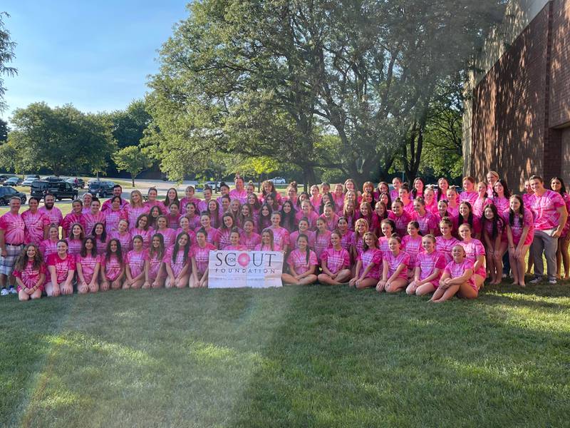 The St. Charles North and East girls varsity swim programs pose for a group photo prior to the 8th annual "For Scout" crosstown swim meet on Thursday, Sept. 8. The proceeds generated go towards the posthumous organization created in memory of Madison "Scout" Cantrell, who died in 2014.