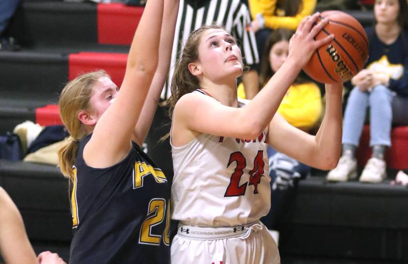 Indian Creek's Audrey Witte gets to the basket ahead of Polo's Natalie Nelson during their Class 1A regional game Tuesday, Feb. 15, 2022, at Indian Creek High School in Shabbona.