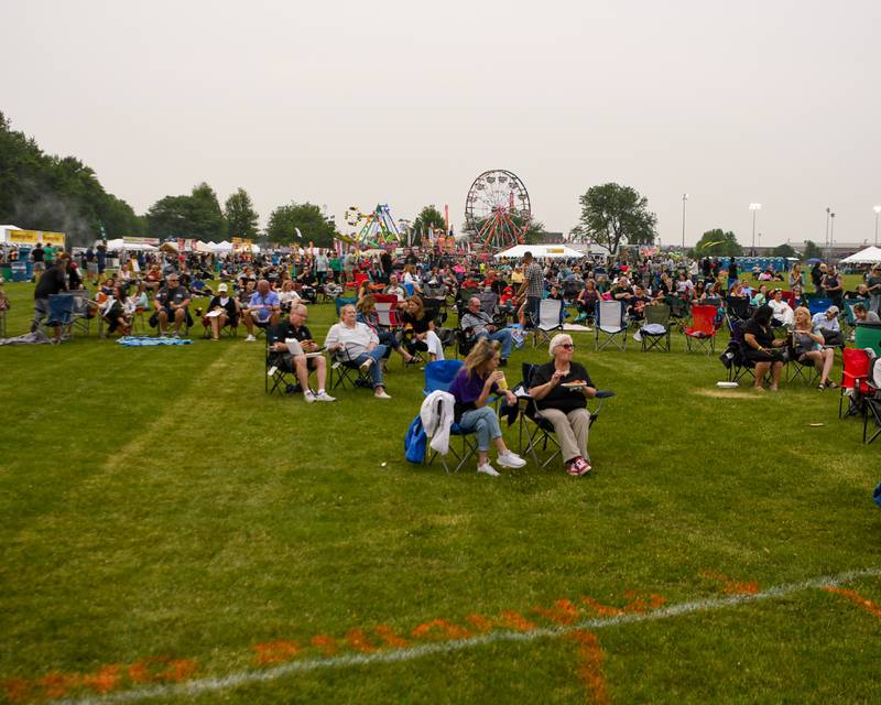 Community members enjoy the music of Marlon and the Shakes during PrairieFest on Thursday June 12, 2025, held at PrairieFest Park in Oswego.