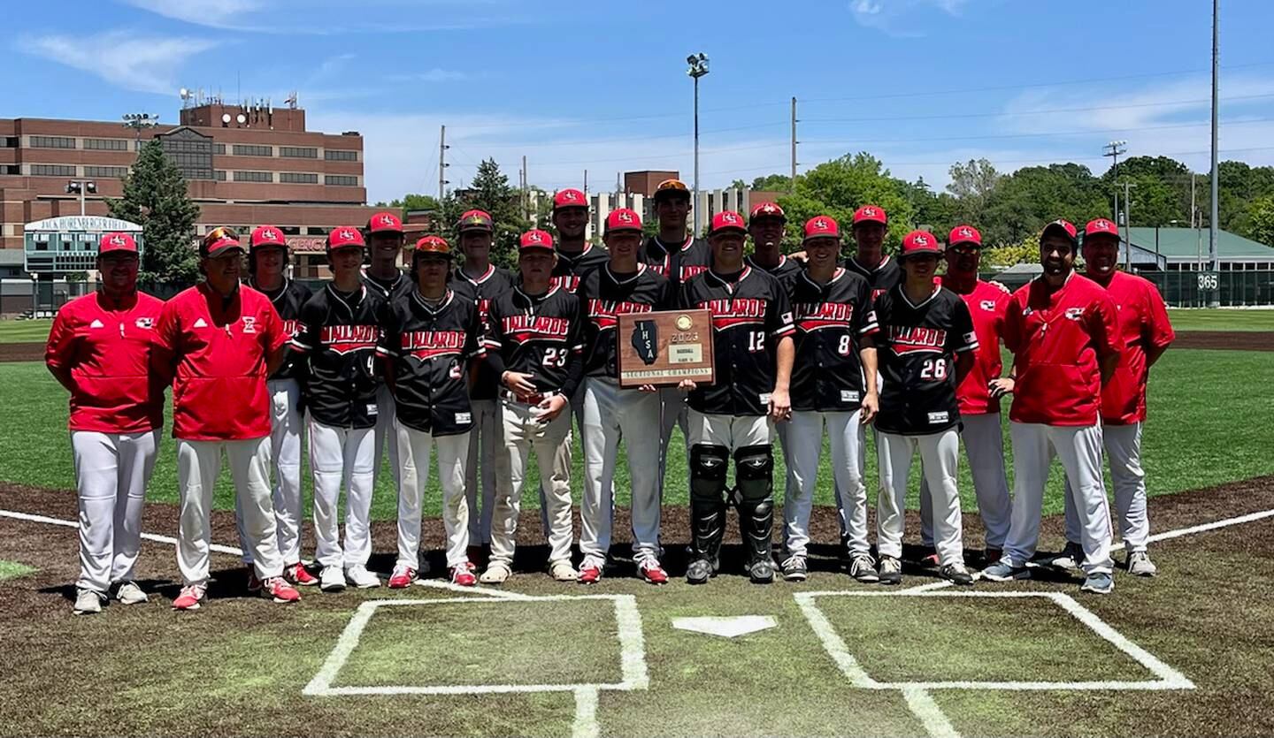 The Henry-Senachwine baseball team poses with its plaque after defeating Milford 6-1 in the Class 1A Illinois Wesleyan University Sectional championship Saturday in Bloomington.