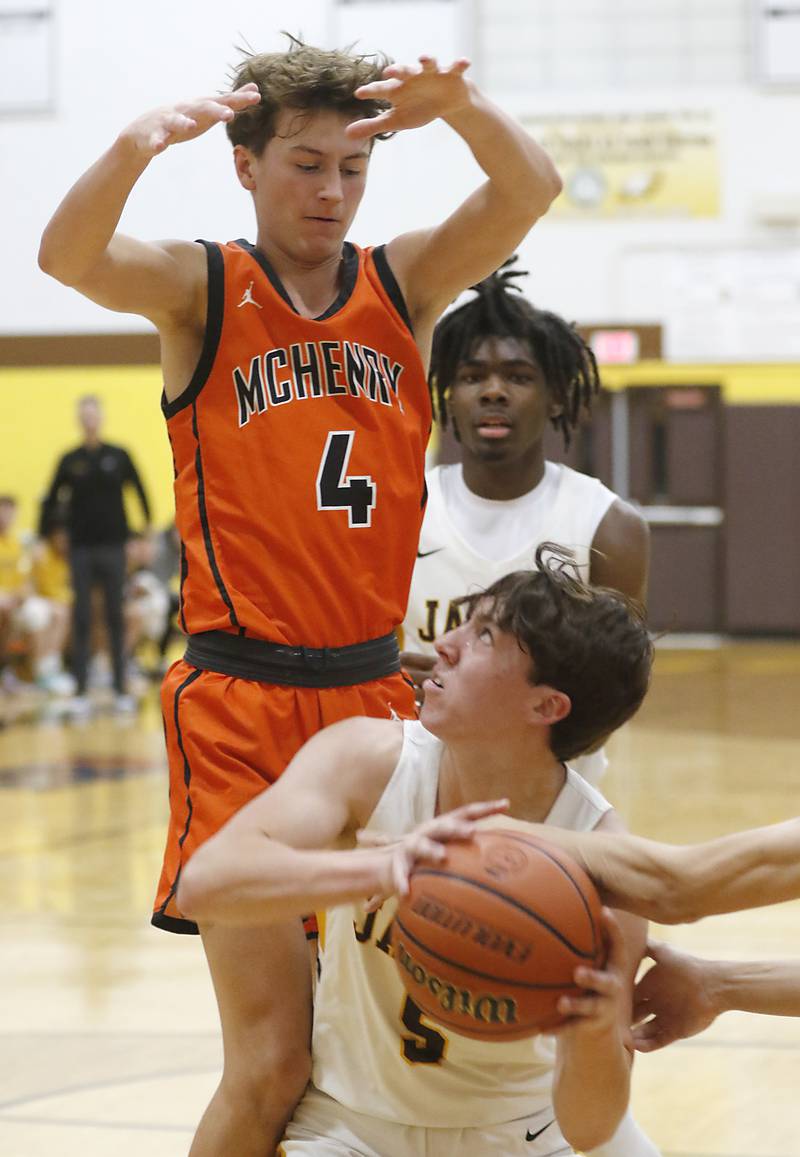 Jacobs' Mark Takasaki tires to fake out McHenry's Dylan Hurckes during a Fox Valley Conference boys basketball game on Wednesday, Nov. 29, 2023, at Jacobs High School in Algonquin.