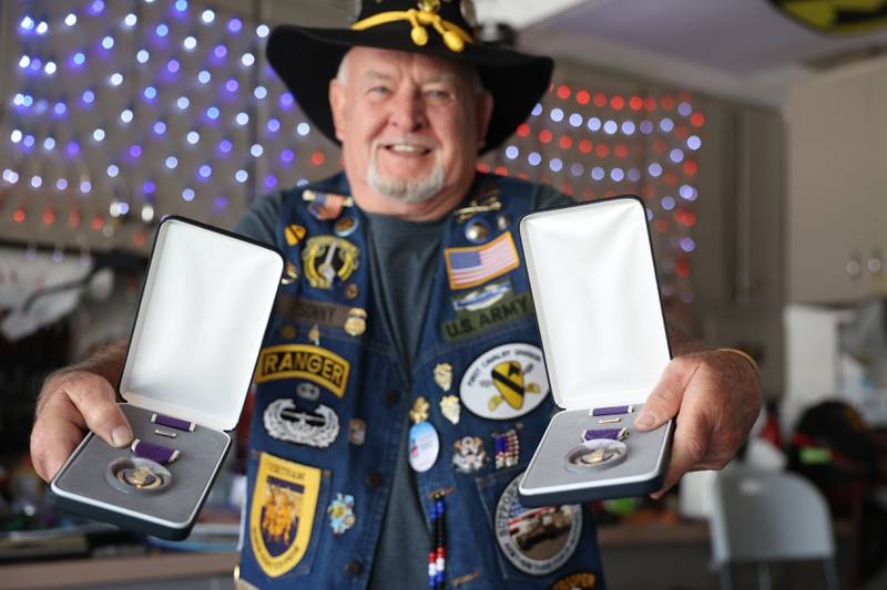 Jerome “Sonny” Zdancewicz holds up two Purple Heart, with a third in the process of being sent. Sonny sustained his injuries while serving in Vietnam in 1968 through 1970. Friday, July 29, 2022 in Romeoville.