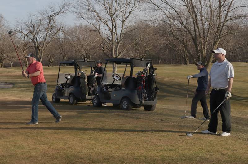 Chris Johnson of Ottawa, (left) tees off with golfers Spencer Huberty, Wes Schmidt and Steve Taylor on Monday, Feb. 26, 2024 at Deer Park Golf Course. Record warm temperatures of 70 degree weather made for a beautiful day of golf.