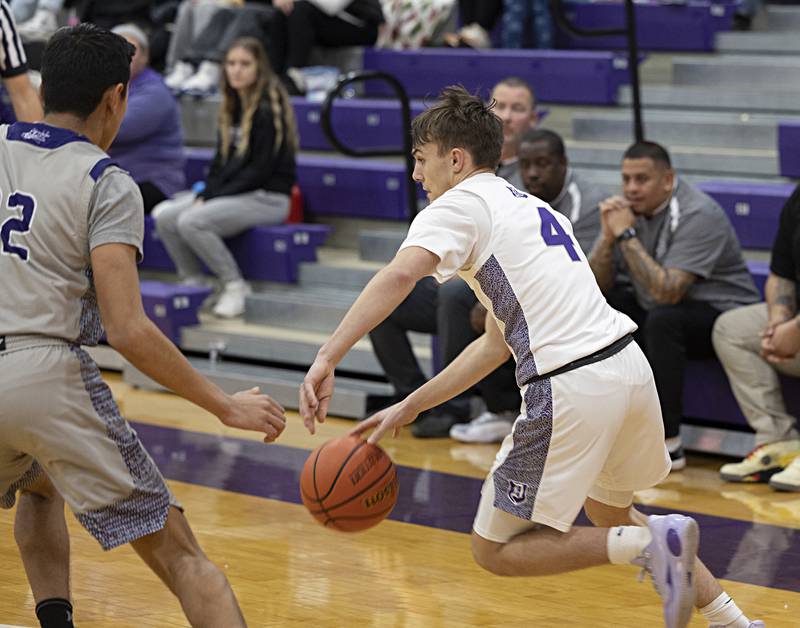 Dixon’s Brady Feit handles the ball against Plano Wednesday, Dec. 6, 2023 at Dixon High School.