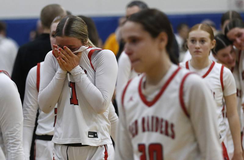 Huntley's Anna Campanelli battles her emotions after Huntley was defeated by Loyola Academy in the IHSA Class 4A Gurnee Warren Supersectional girls basketball game on Monday, March 3, 2025, at Warren Township High School in Gurnee.
