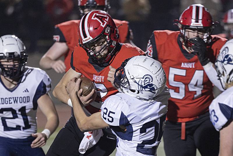 Amboy’s Eddie Jones lowers his shoulder as he barrels in for a two-point conversion against Ridgewood’s Roy Sandburg during the I8FA championship Friday, Nov.17, 2023 at Monmouth College