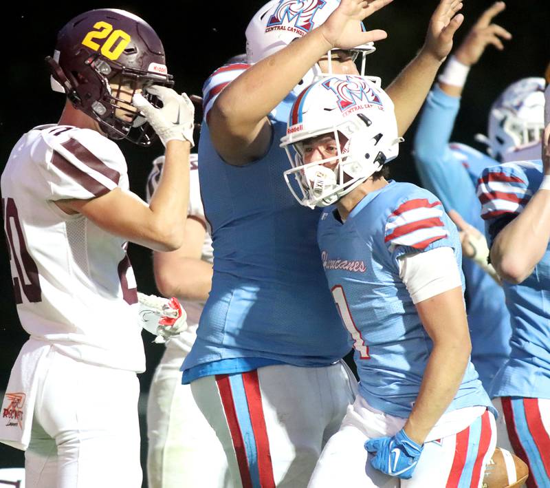 Marian Central’s Eddie Kowalczyk, center, celebrates after scoring a touchdown against Richmond-Burton in varsity football at George Harding Field on the campus of Marian Central High School in Woodstock on Friday, August 29, 2025.