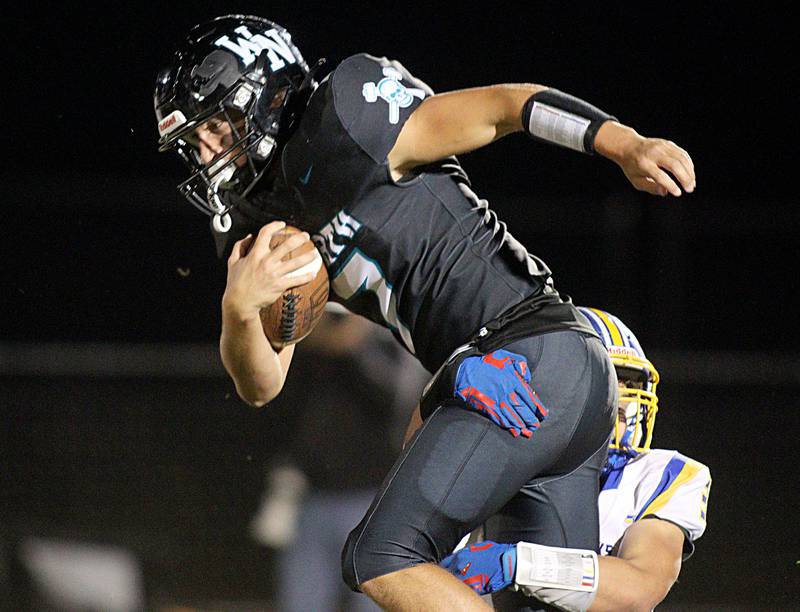 Woodstock North’s Parker Halihan runs the ball against Johnsburg in varsity football on Friday Sept. 27, 2024, at Woodstock North High School in Woodstock.